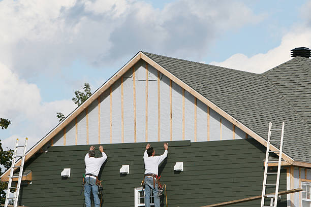 Professional Storm Damage Siding Repair technician working in Poplar Branch, NC